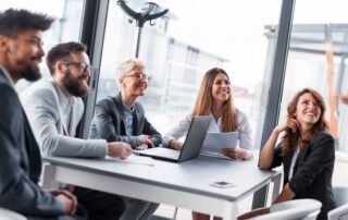 HR managers in a meeting about recruitment agencies