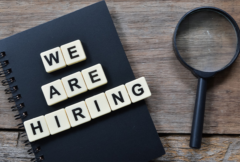the-recruitment-consultancy-hiring-the-right-people 'We are hiring' letters and magnifying glass