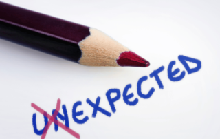 A pencil has altered the word from unexpected to expected